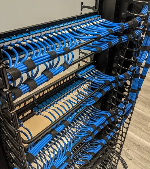 Punched patch panel in a network rack